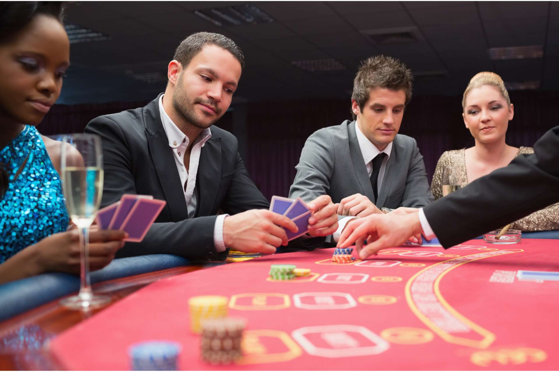 Group of 4 at a poker table